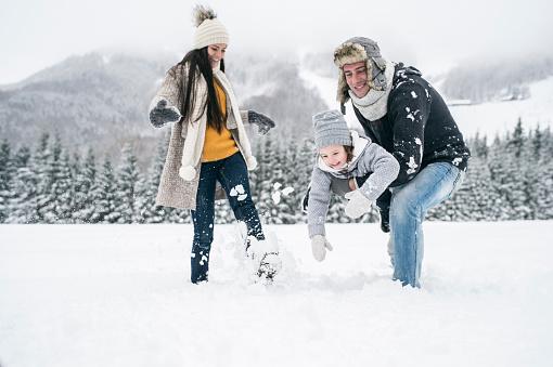 Family playing in snow